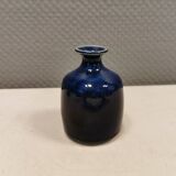 A small vase with blue running glaze with a ‘thin’ neck, from Swedish Kjell Sunesson