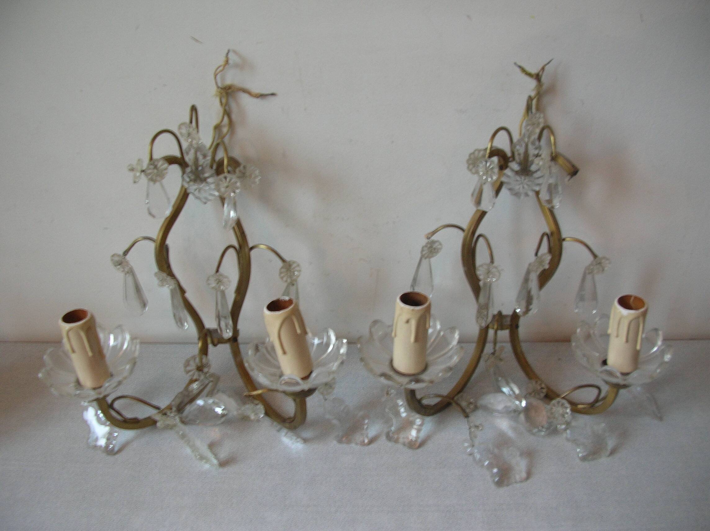 Old pair of double lamp lights with glass and brass pendants, retro decoration