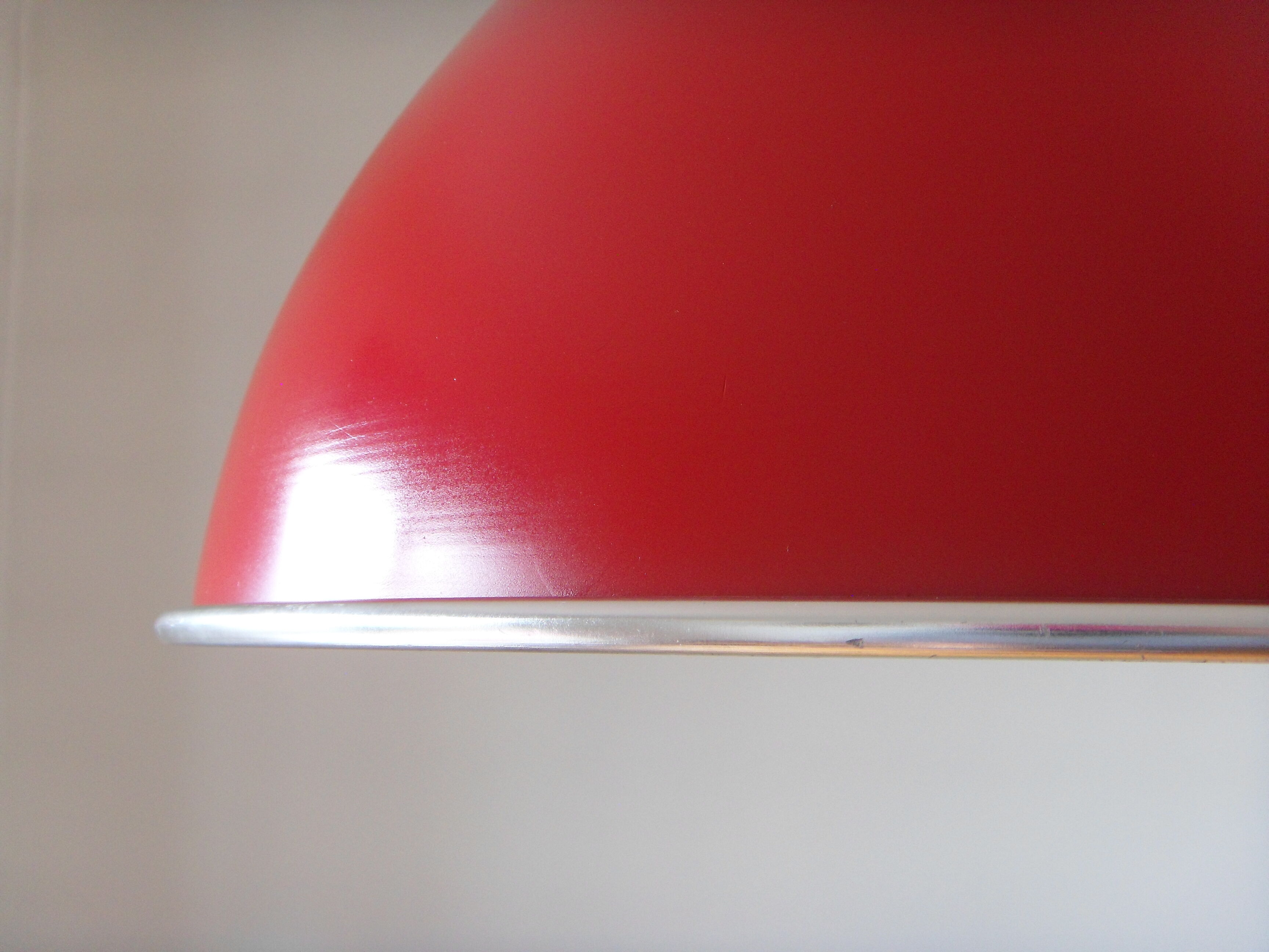 Large red aluminum lamp.