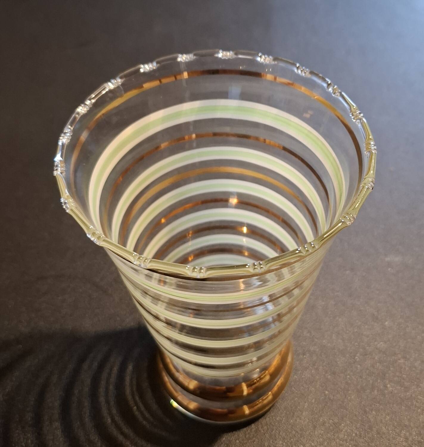 Vintage vase with green and gold trim.