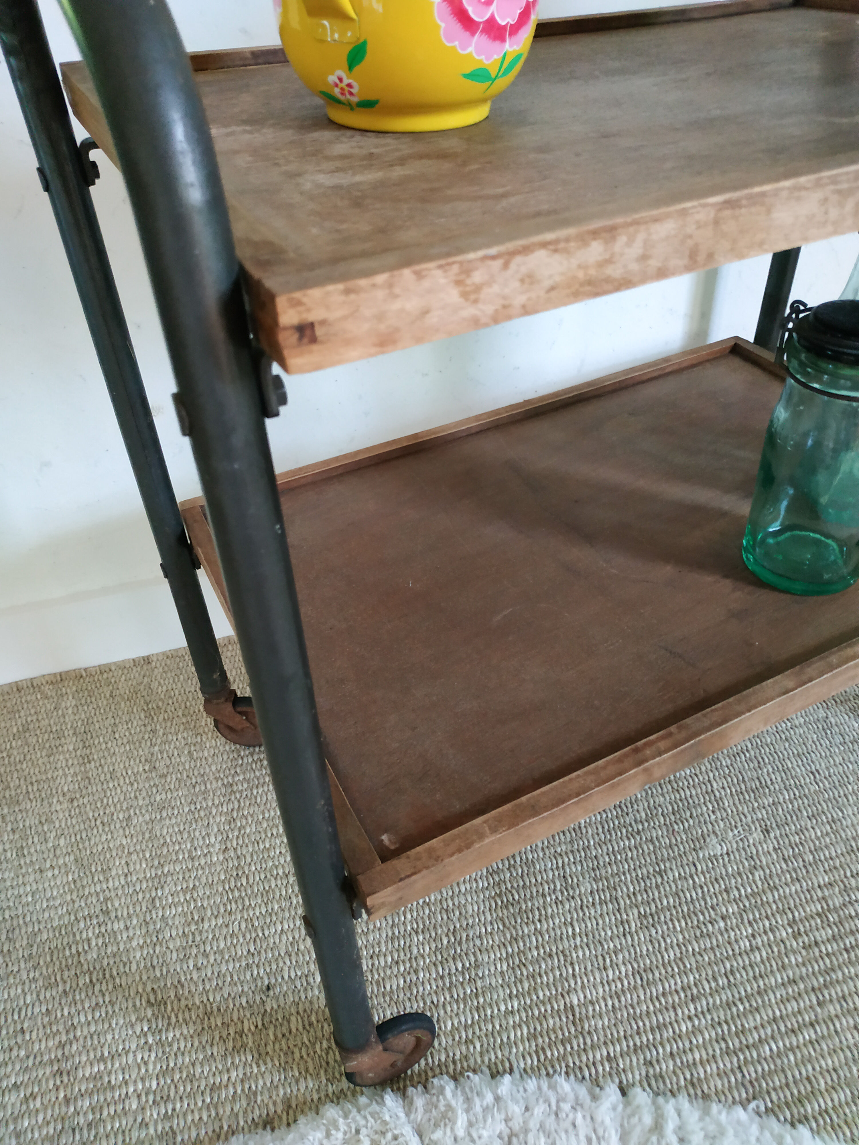 Serving table on metal wheels and antique wood