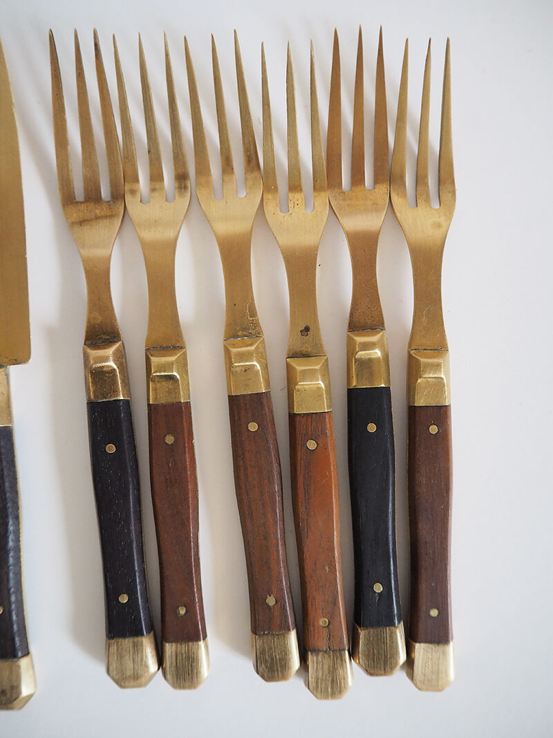 Set of old dessert cutlery in wood and brass