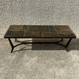 Coffee table with stone top and iron legs