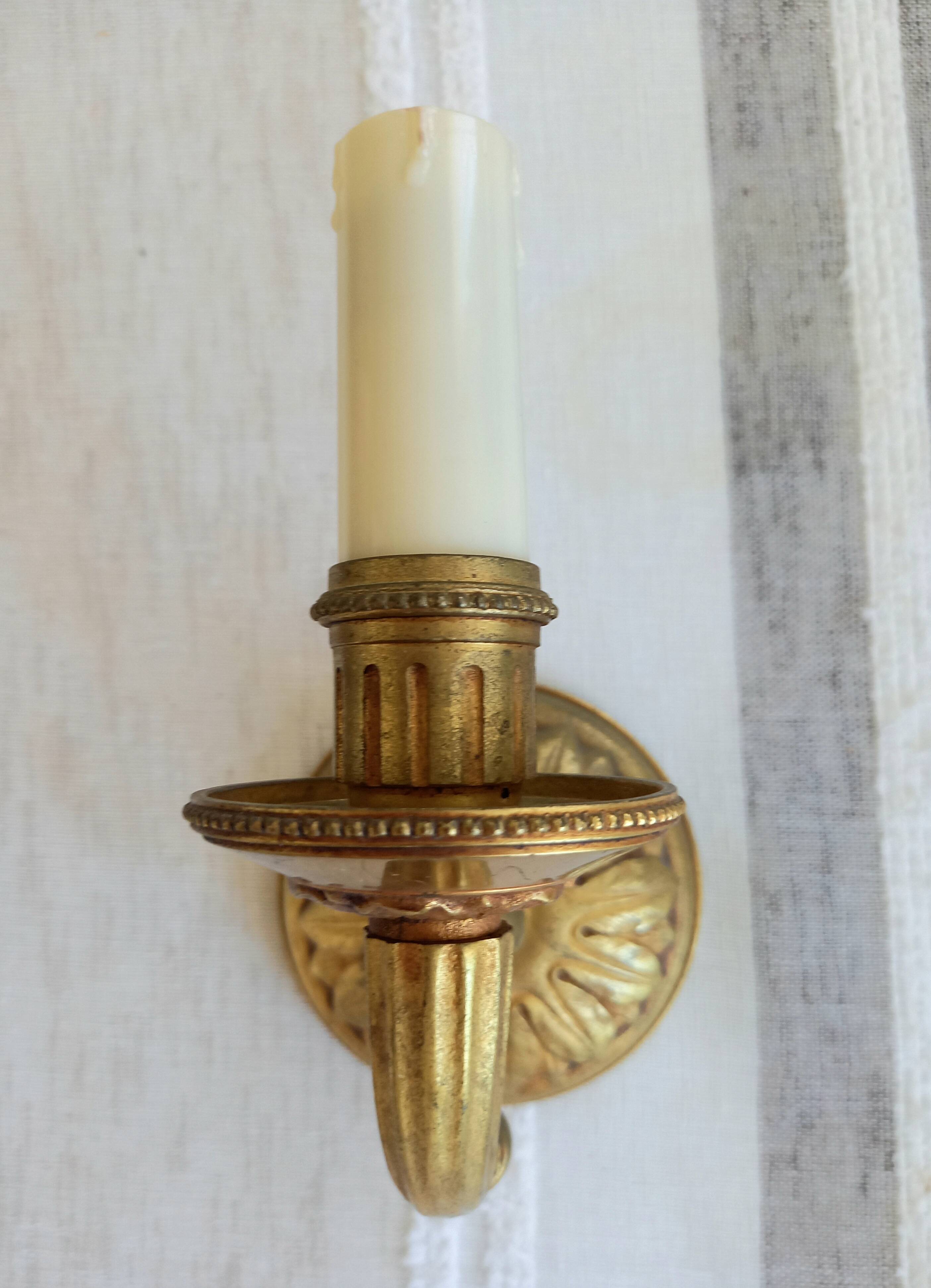 Electrified bronze gold wall sconces... in pairs.