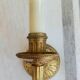 Electrified bronze gold wall sconces... in pairs.