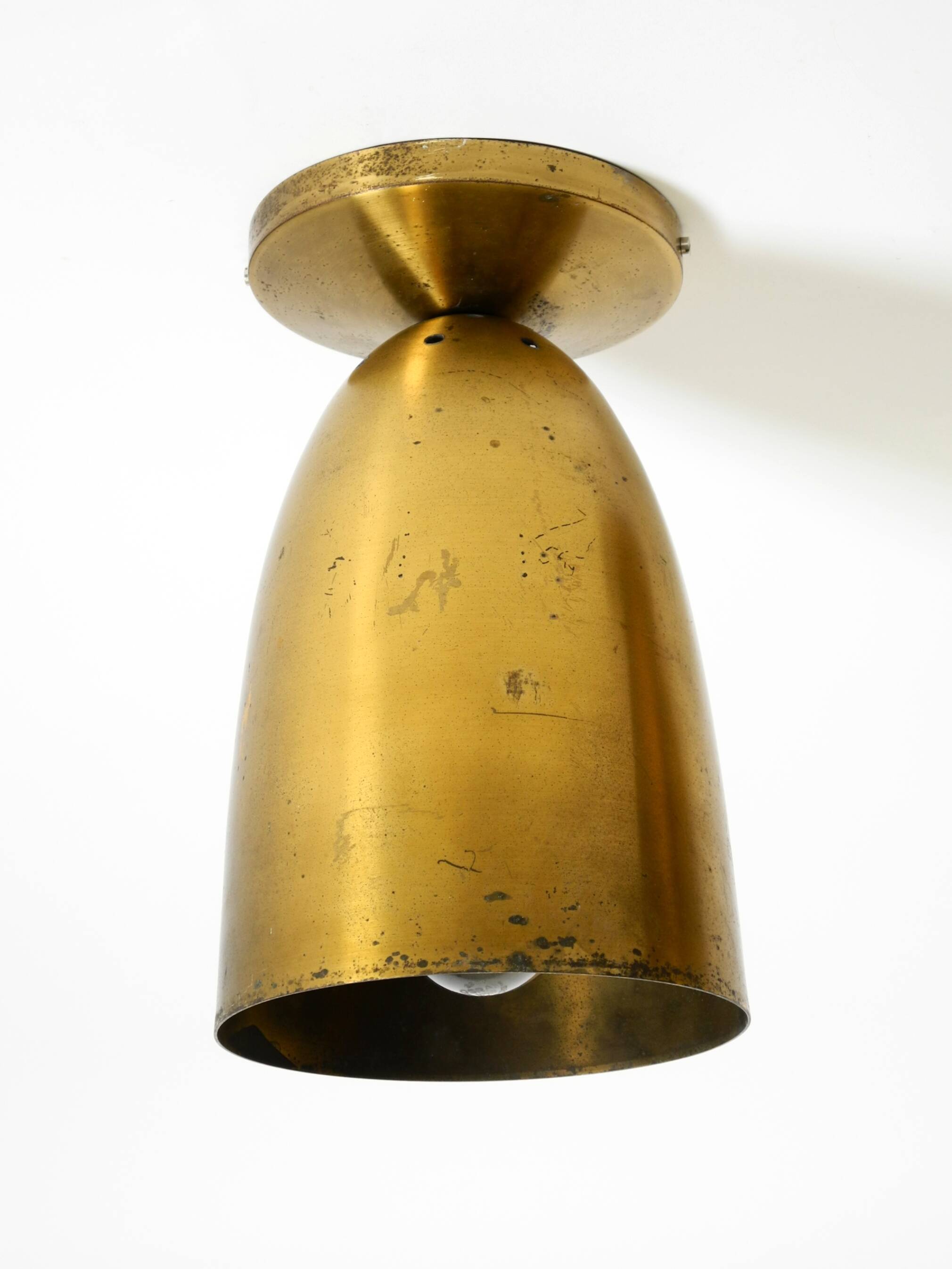 A pair of large, original Mid Century Modern brass ceiling lamps