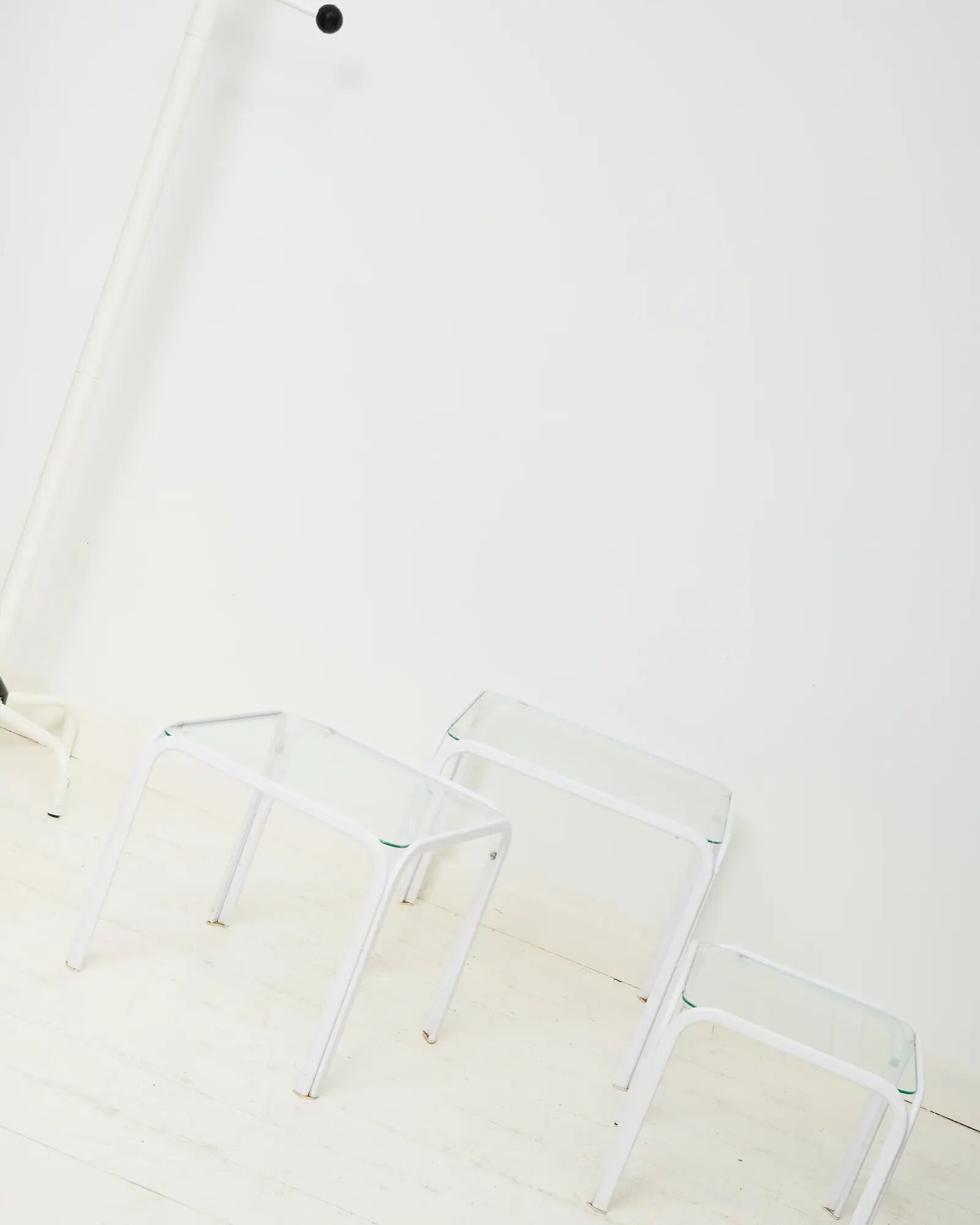 Nested tables in white lacquered metal, Italy, 1970s.