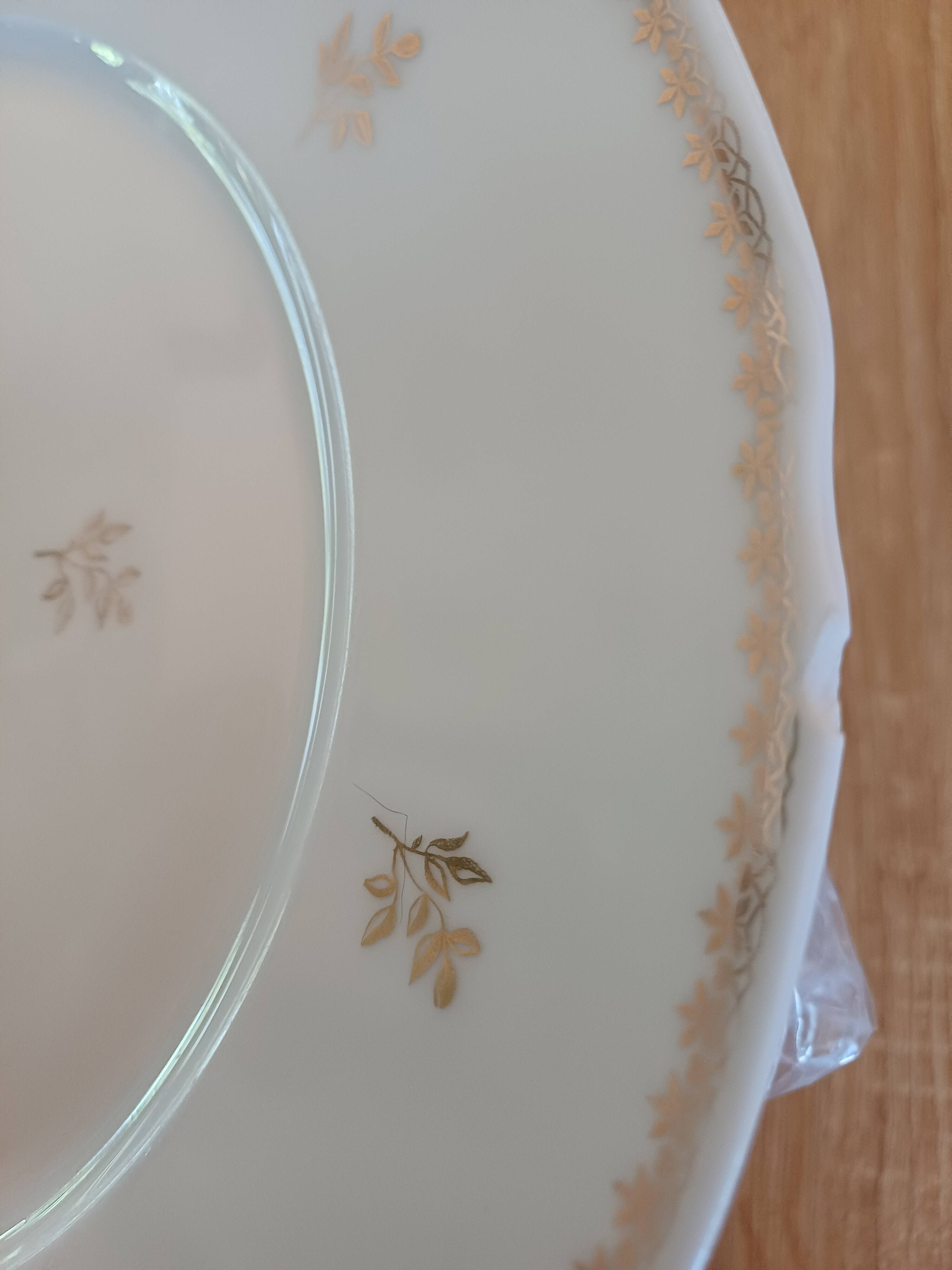 A lot of old white and gold porcelain plates T de F.