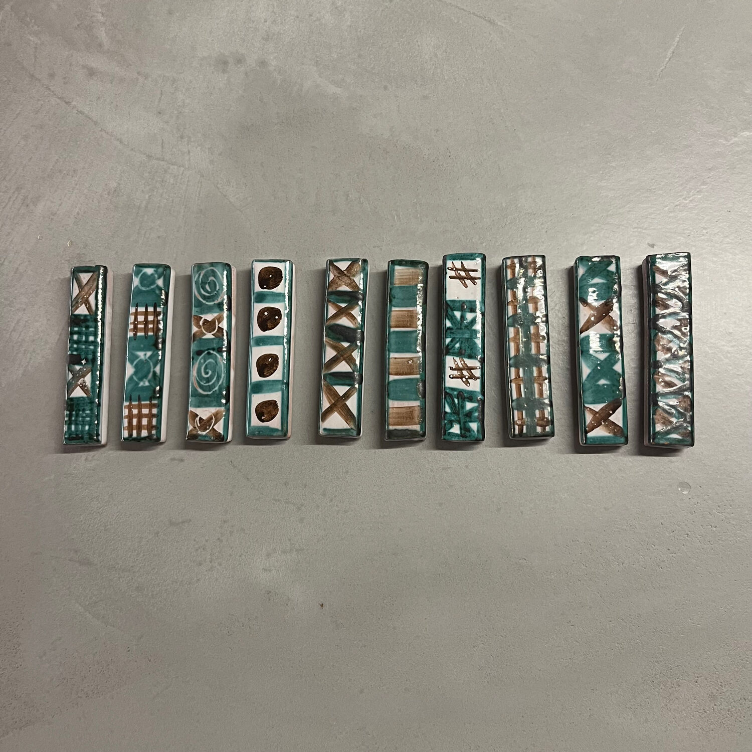 Set of 10 knife rests by Robert Picault