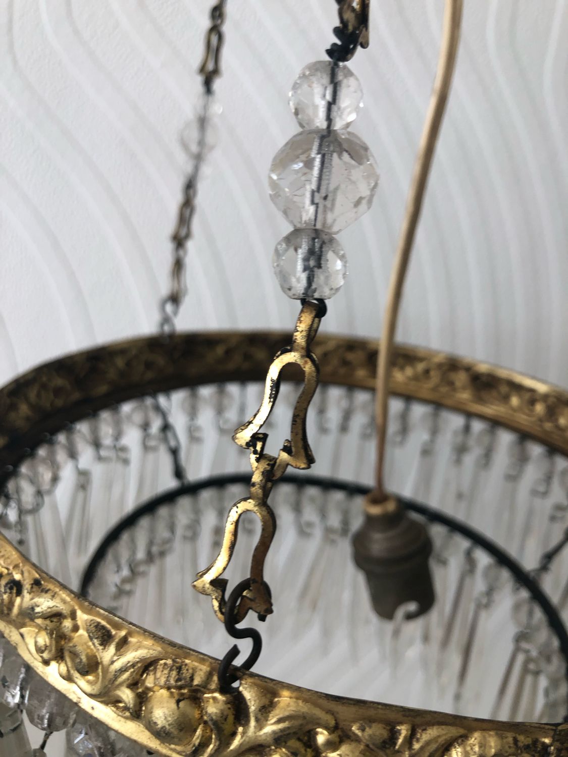 Vintage tassel chandelier has 2 glass and brass crowns