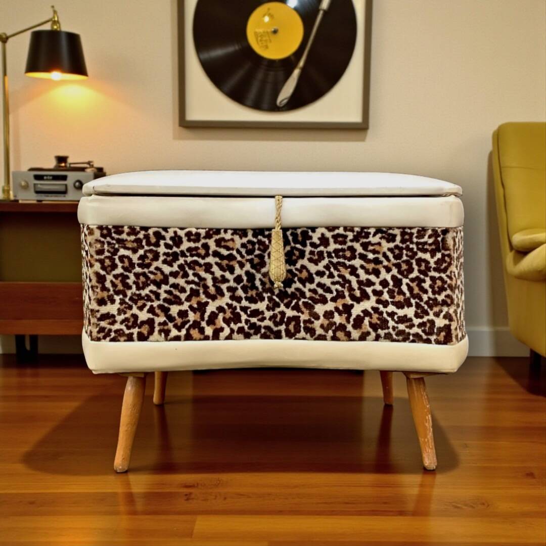 Vintage storage stool with compass legs in white faux leather and leopard velvet.