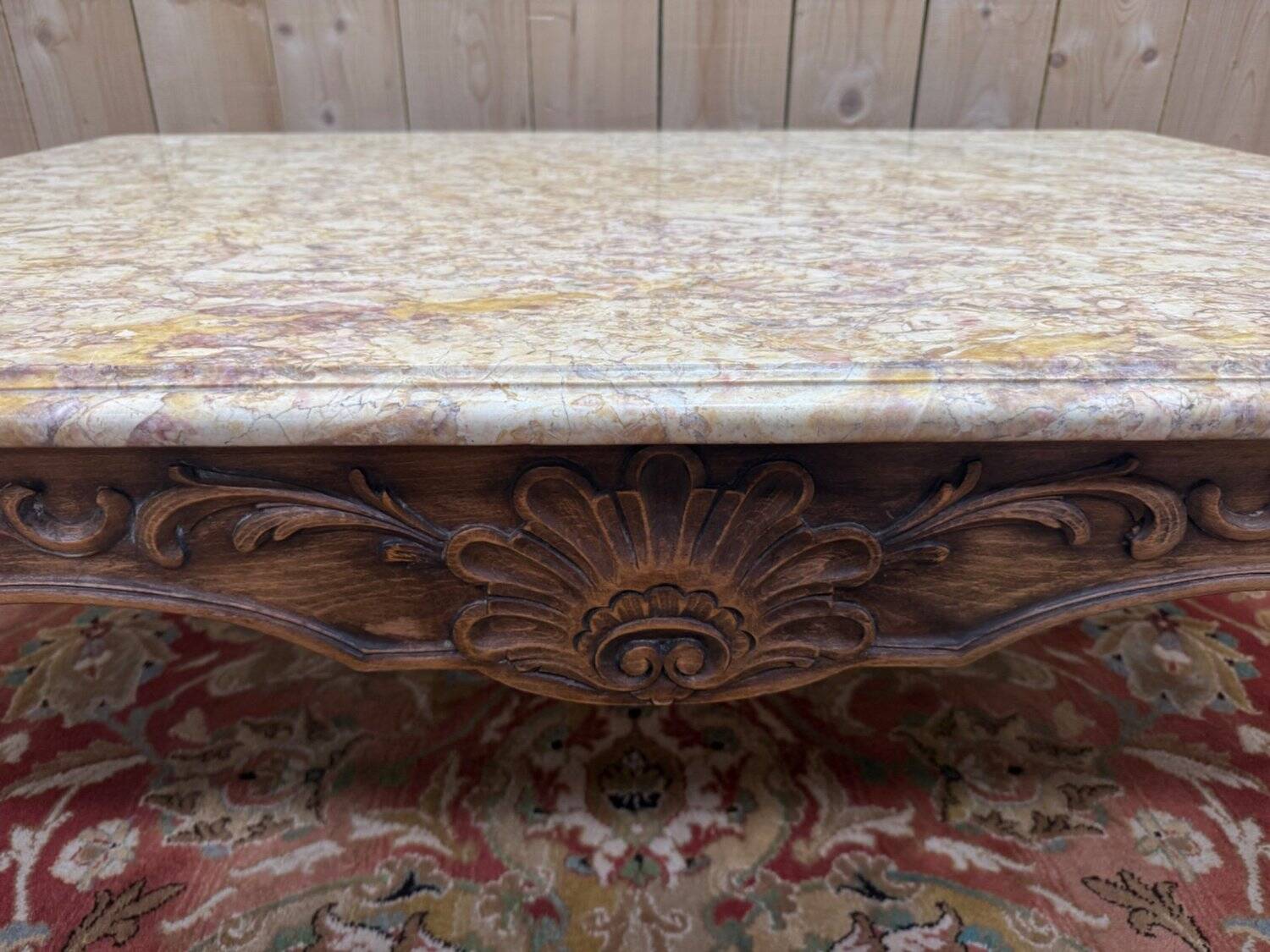 Louis XV style coffee table in walnut with a marble top.