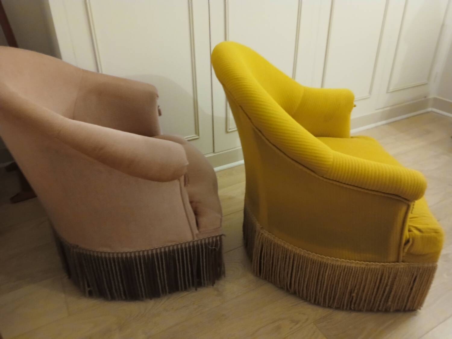 Set of 2 yellow and pink velvet tub chairs.
