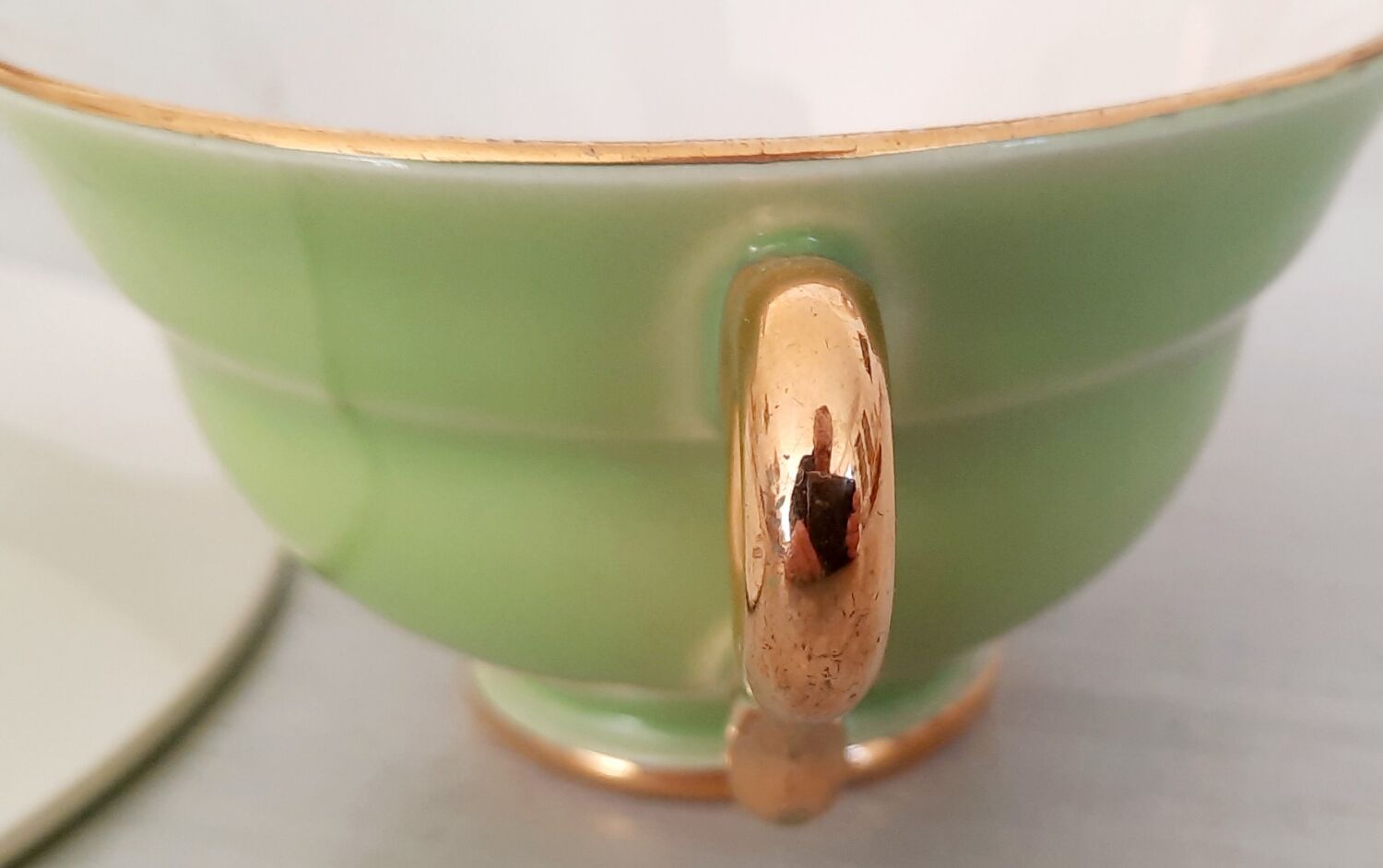 Coffee cup and under cup in green Salins earthenware and vintage gold net