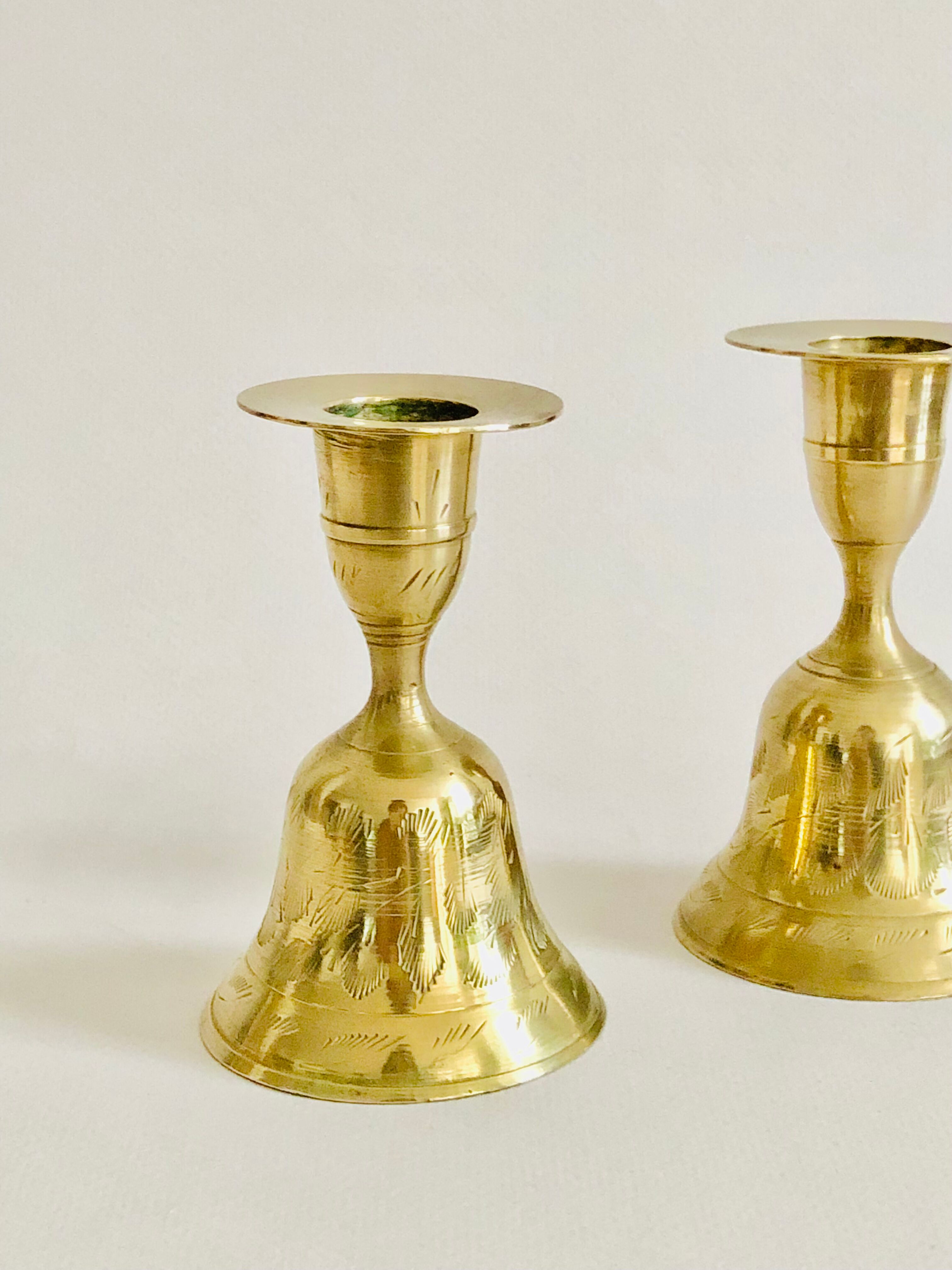 Pair of brass "bell" candle holders
