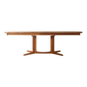 Glostrup dining table, 1980s, solid teak, by Johs. Kristoffersen & Søn, with two extension leaves