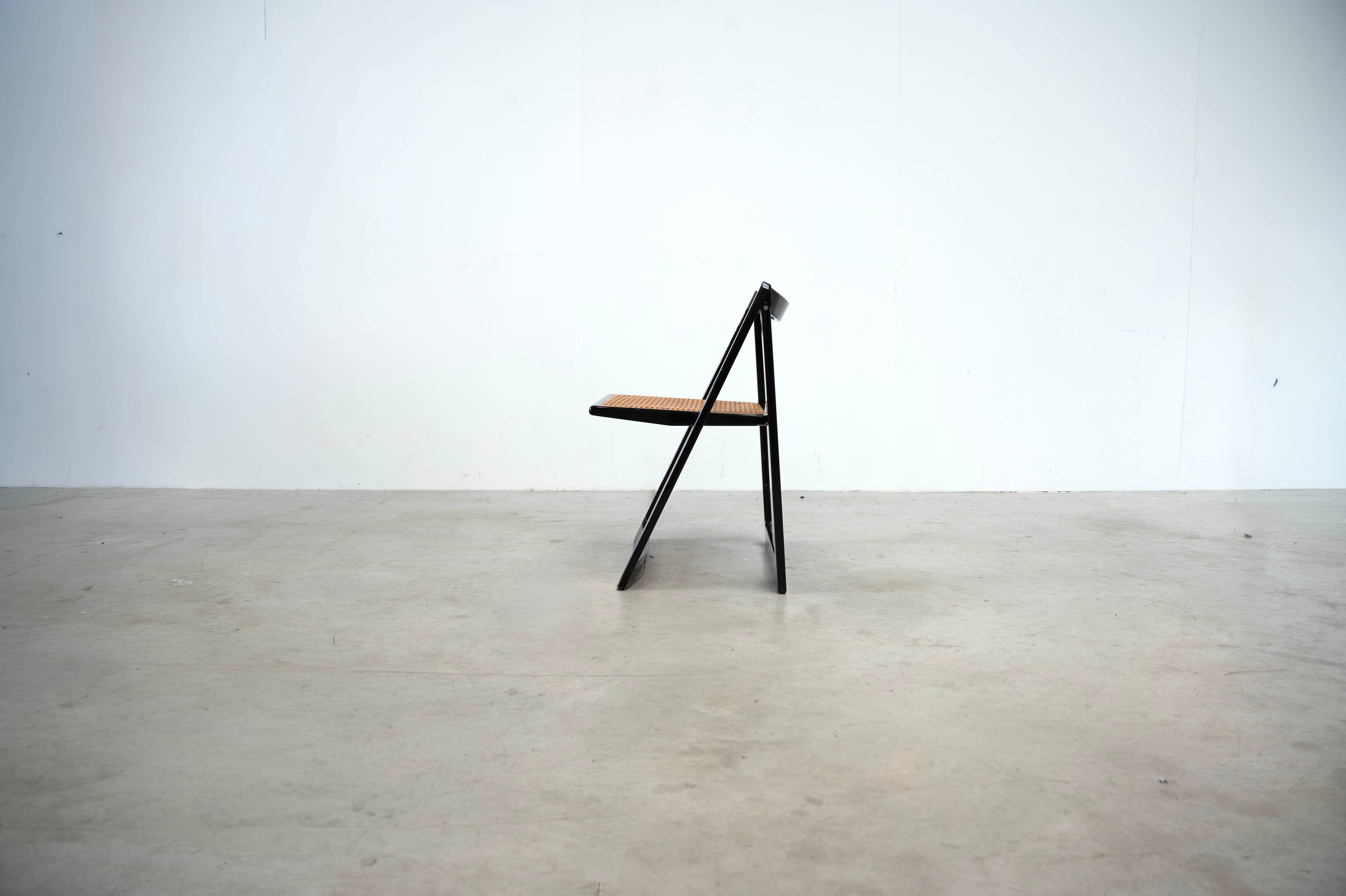 Set of eight folding dining chairs designed by Aldo Jacober for Alberto Bazzani