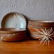 Set of 10 turned stoneware plates, pyritised and glazed, wabi-sabi brutalist.