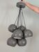 Khaki lamp with 7 bulbs.