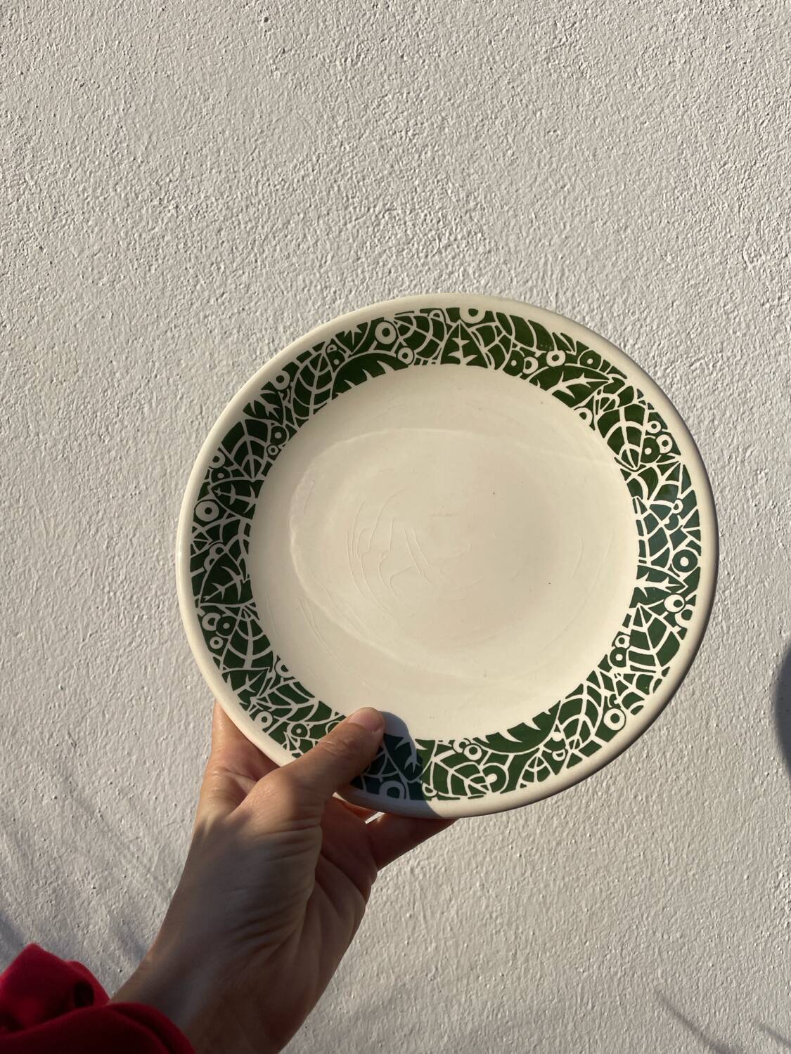 11 vintage Sado International dinner plates with plant motifs