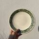 11 vintage Sado International dinner plates with plant motifs