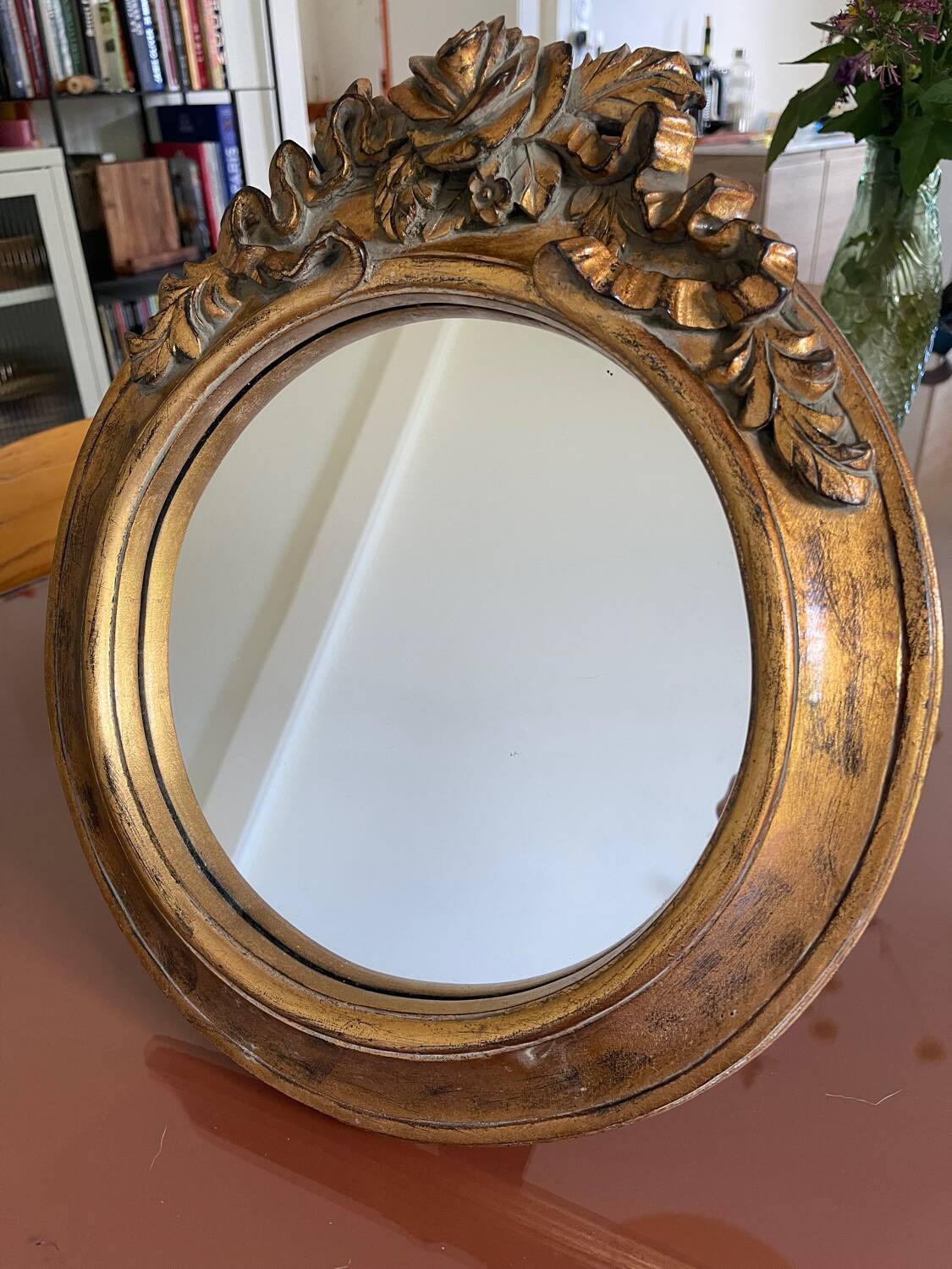 Round carved wooden mirror