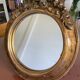 Round carved wooden mirror