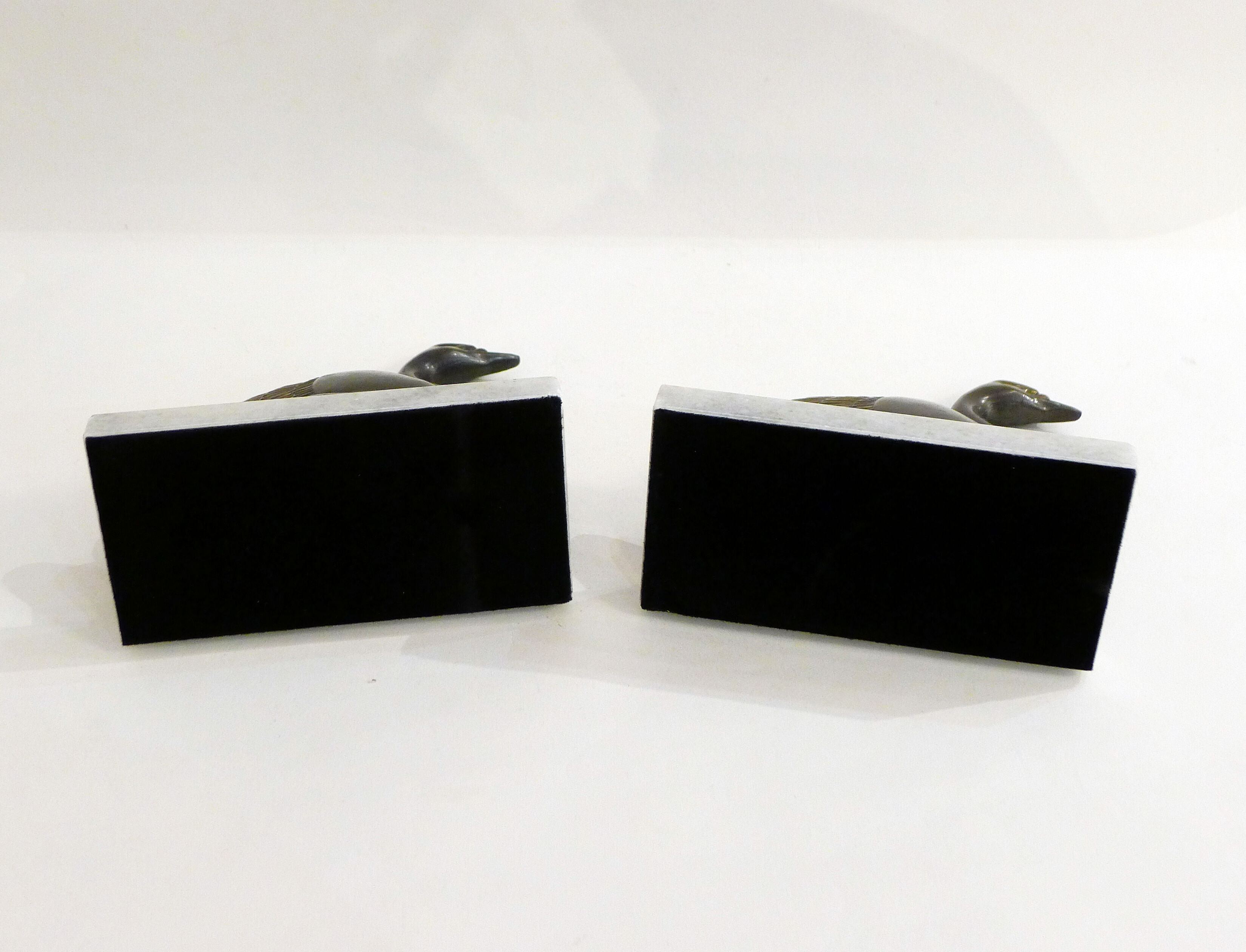Swan bookends on marble