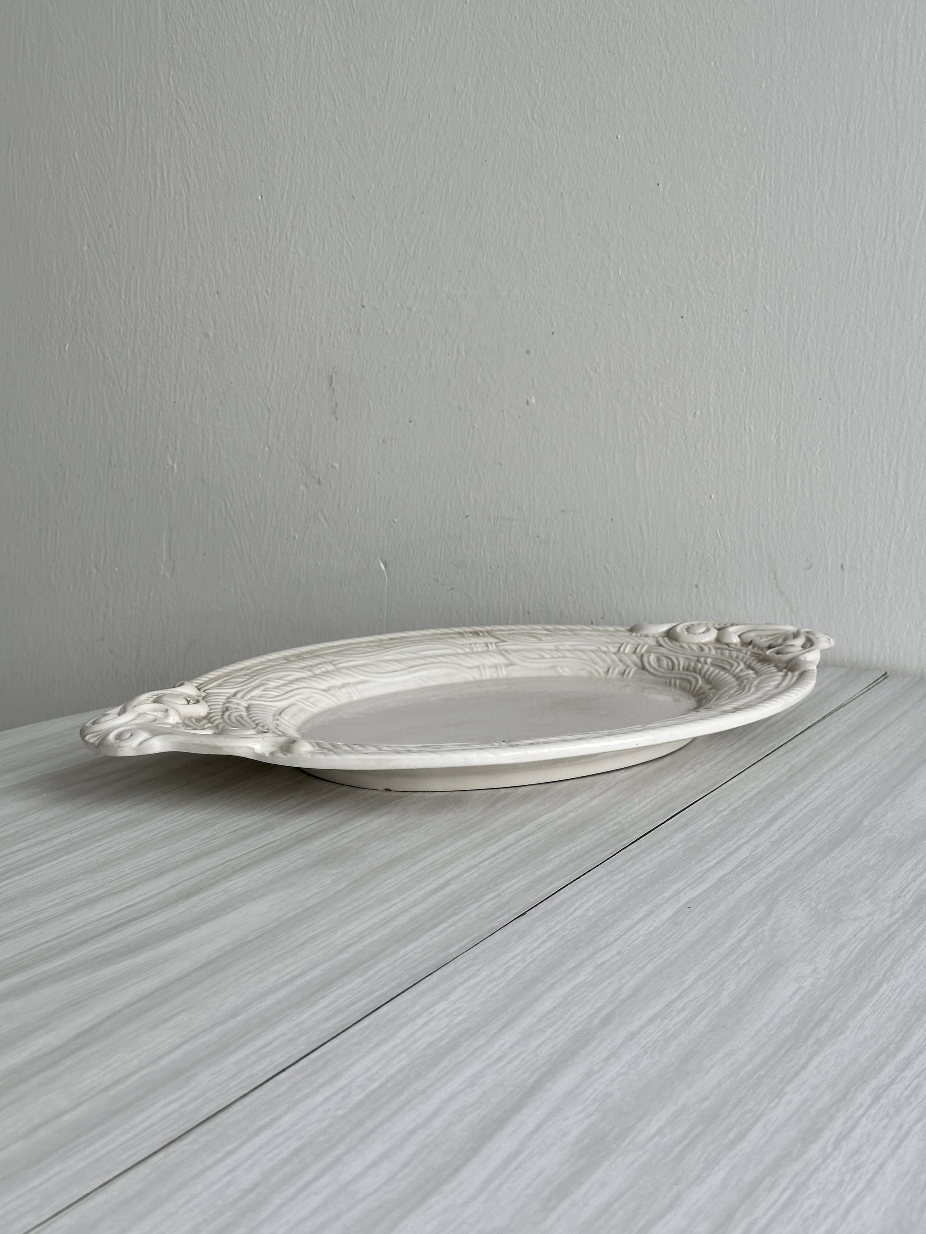 Large oval dish in sculpted white ceramic