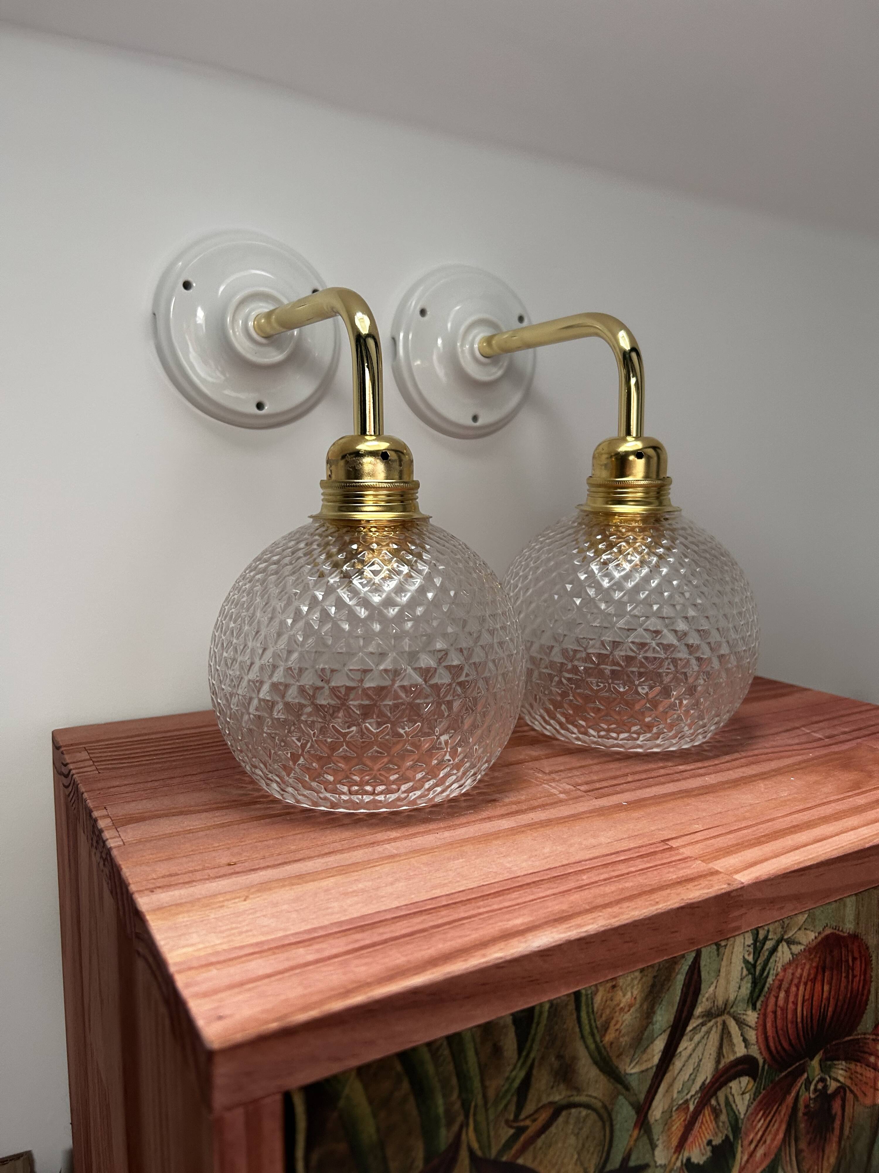 Pair of chiseled glass wall sconces