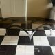 coffee table with metal legs and smoked glass top
