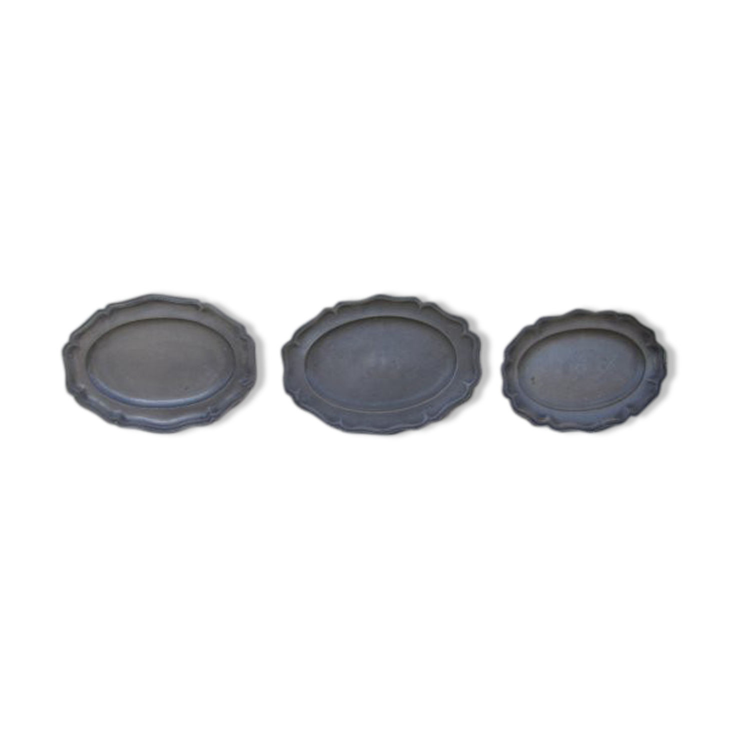 Three dishes in antique tin