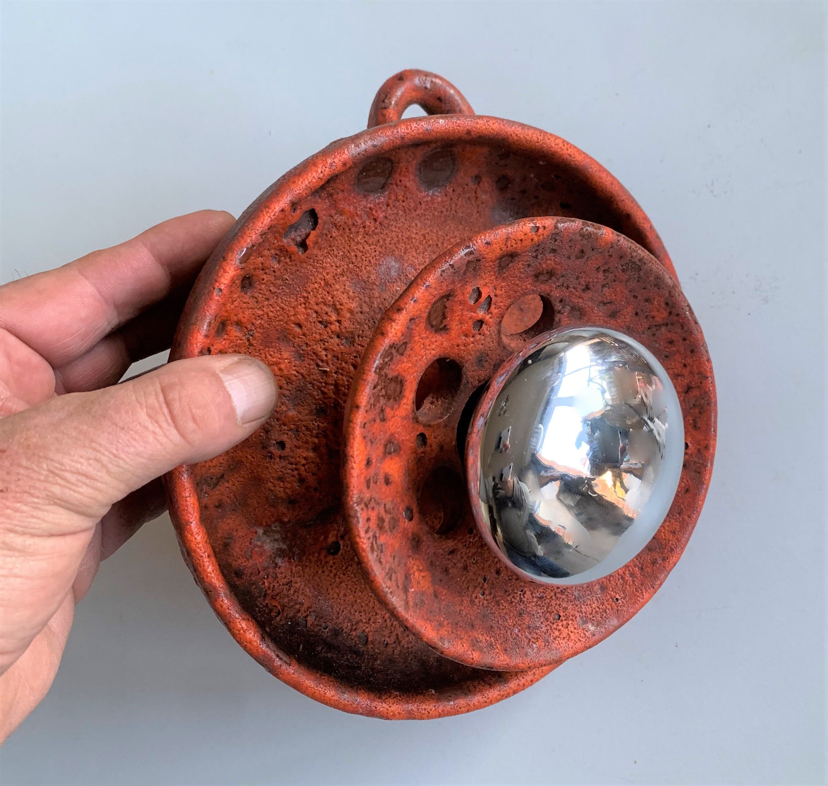 Ambient spot in orange glazed terracotta from the 1960s