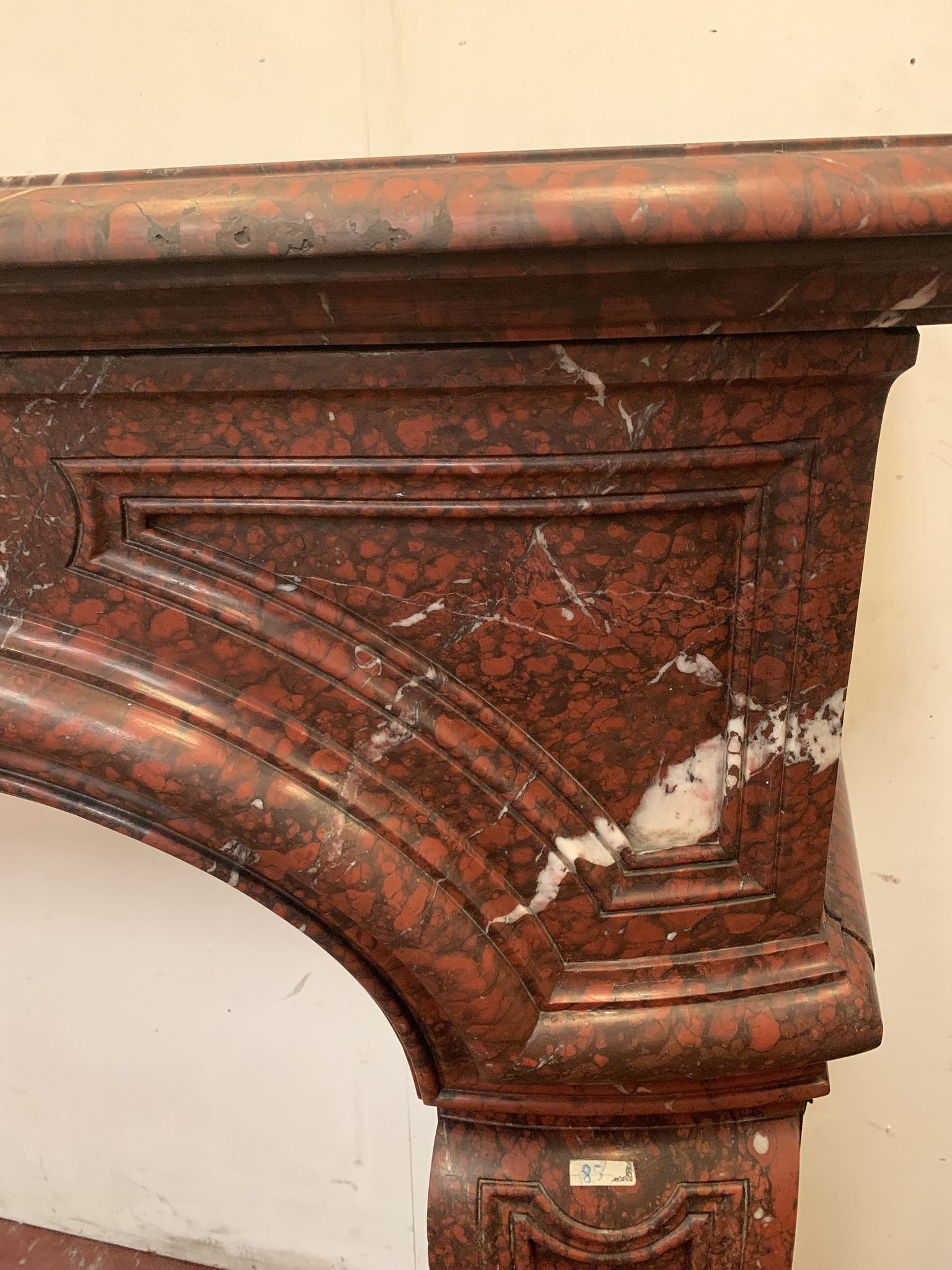 Pair of Louis XIV style fireplaces in red cherry marble. XIX century.
