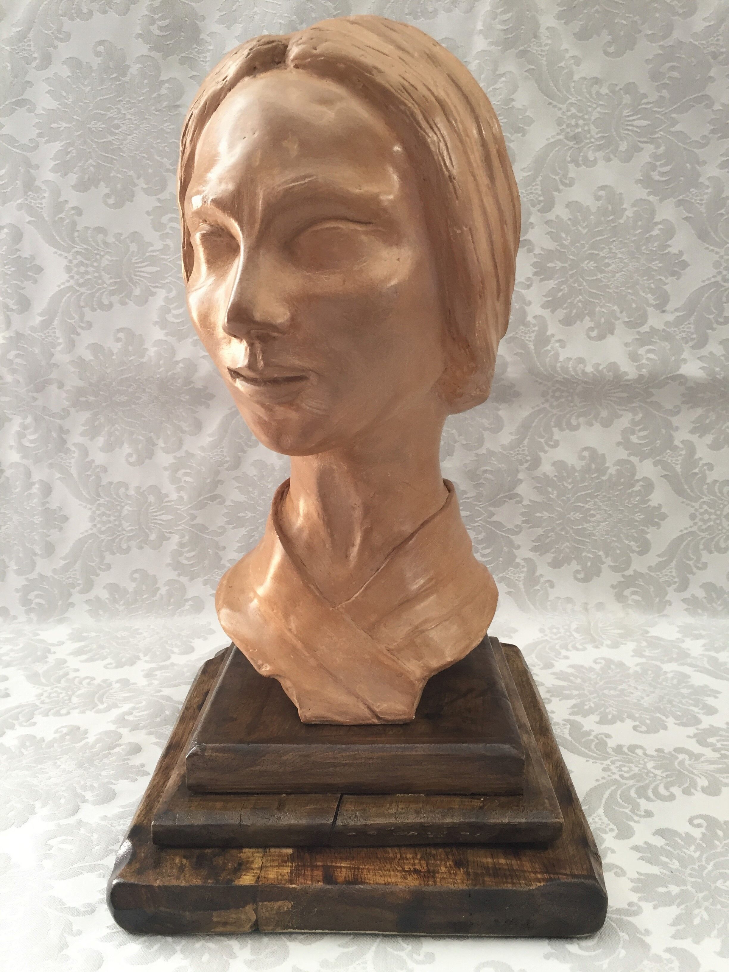 Bust in raw earth of atelier bust face of woman signed j.c.g.