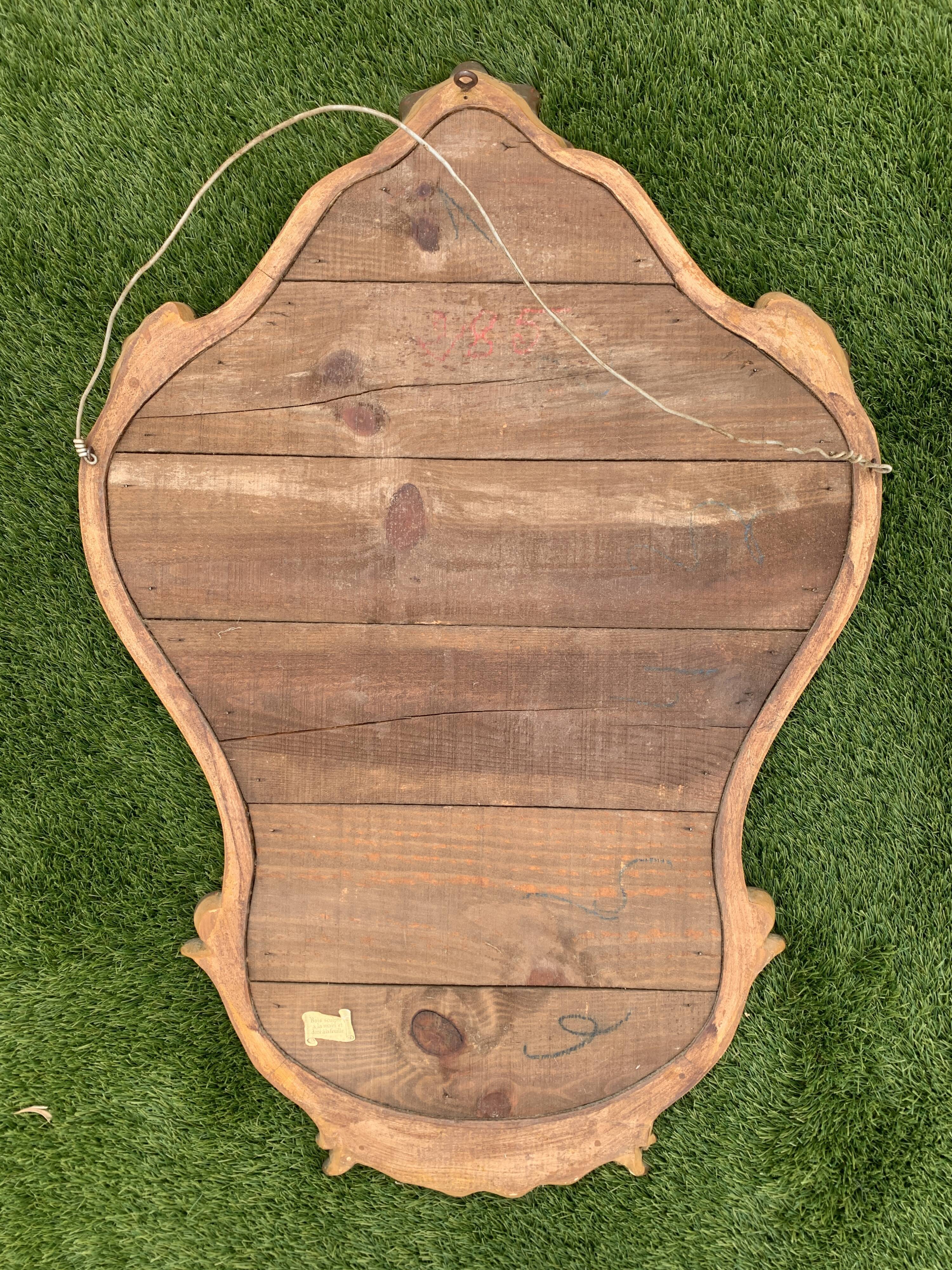 Old mirror in carved wood and gilded leaf, Louis XV rocaille style, twentieth century 59x87cm