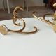Old coat hook in solid golden brass
