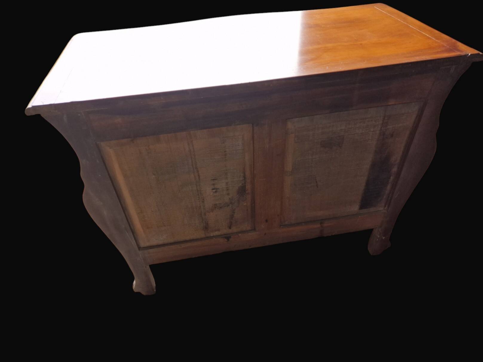 Solid wood commode in an antique style.