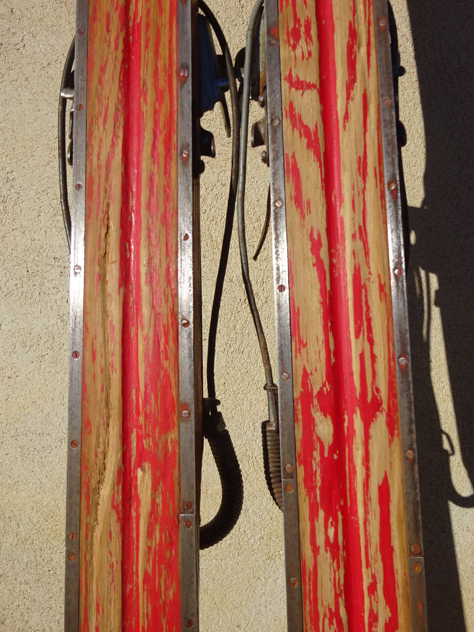 Pair of old wooden skis and metal bindings altiere