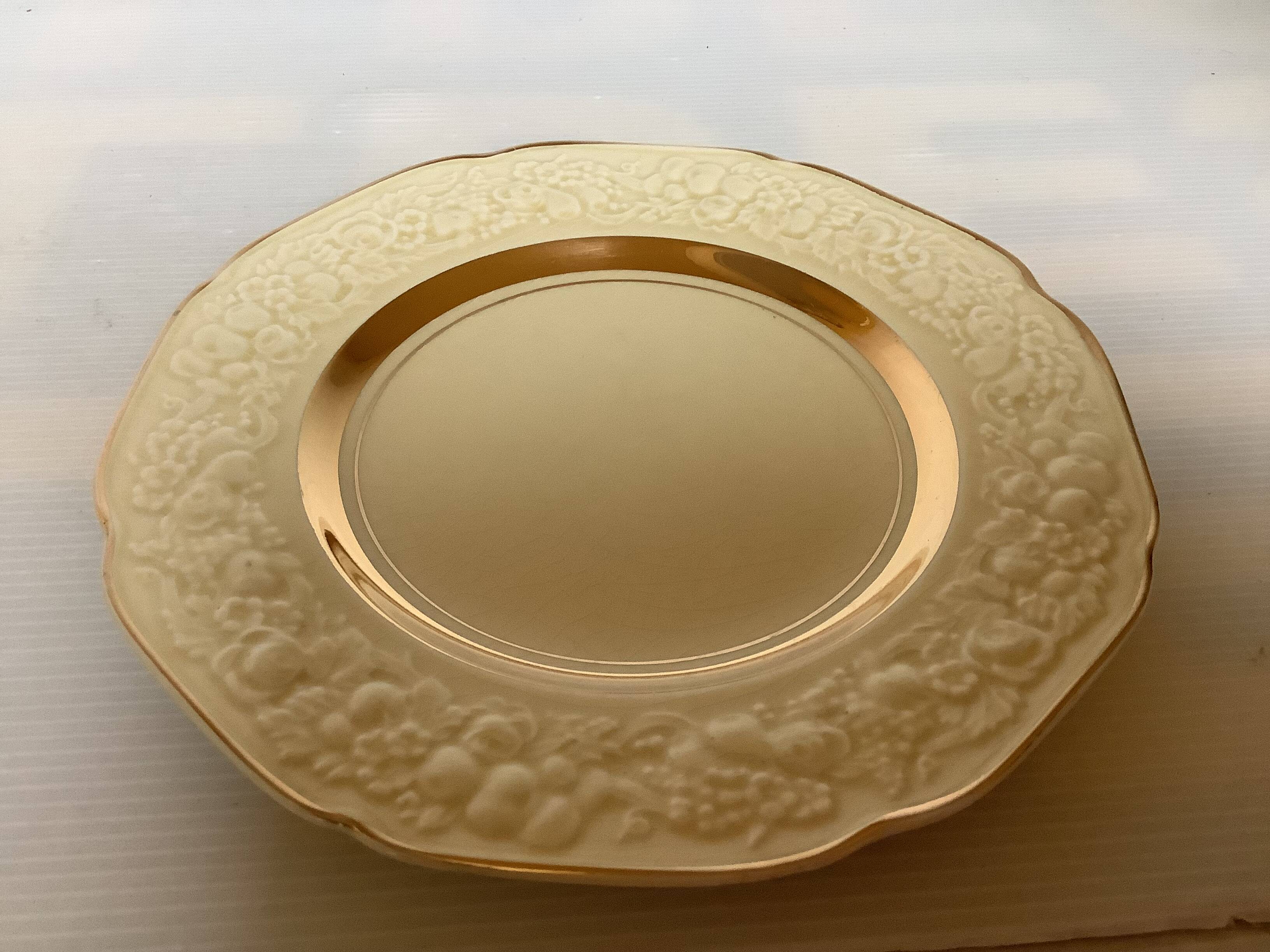 Five small floral plates England