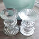 Duo of old glass candlesticks