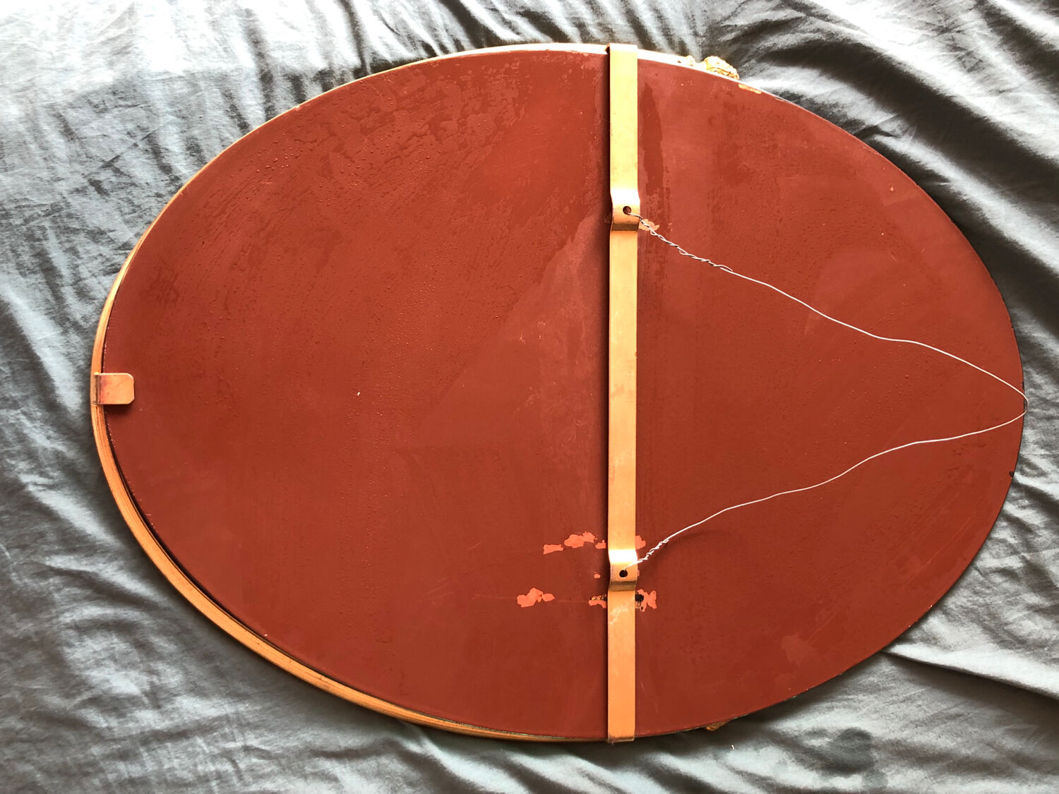 Beveled wall mirror with gold frame