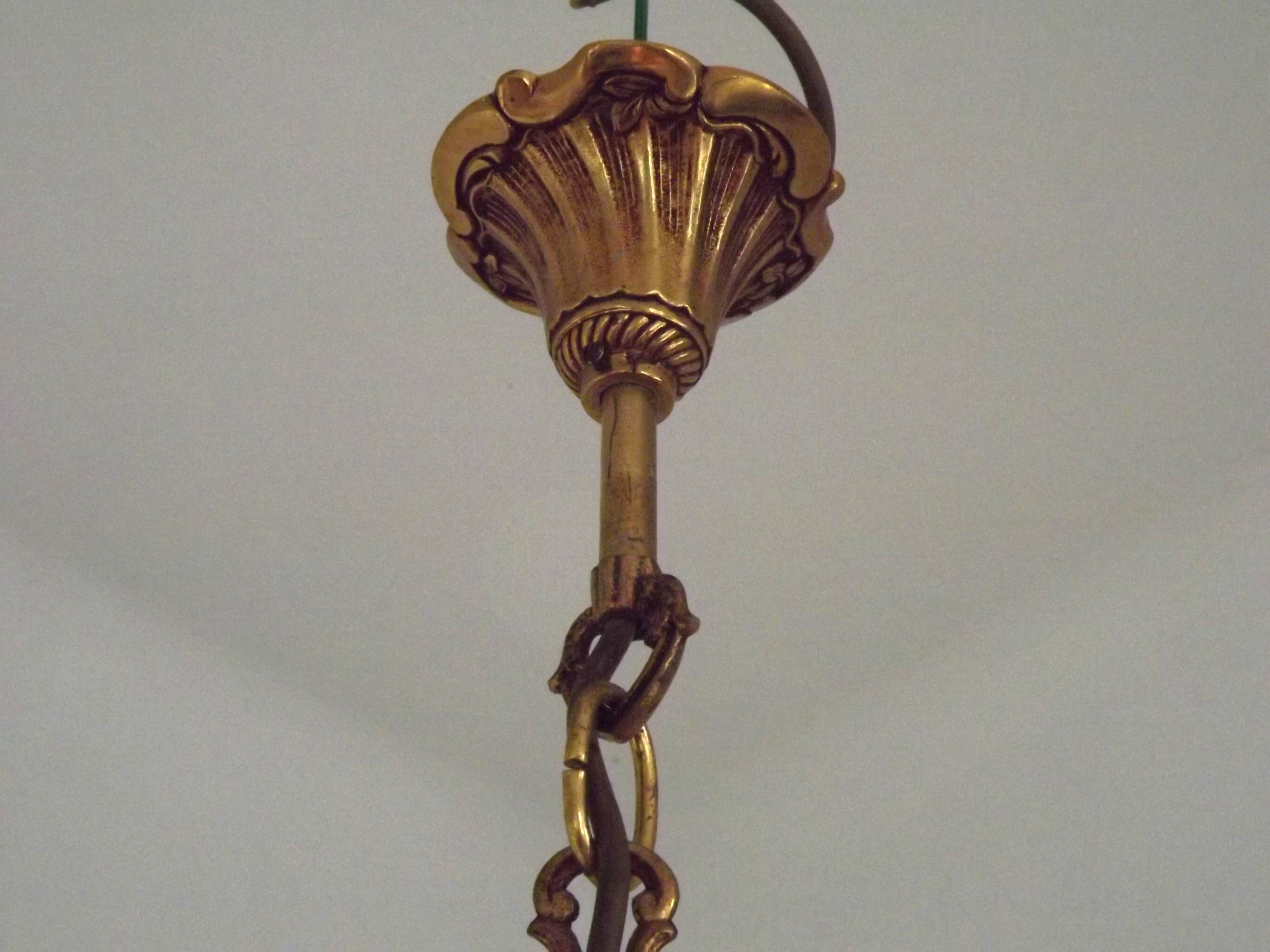 Vintage French traditional style bronze chandelier with 5 lights featuring acanthus leaf details.