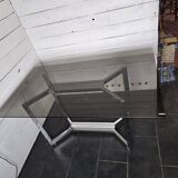 Chromed metal table with smoked glass top