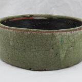 Bowl or empty pocket in cracked green sandstone varnish raku