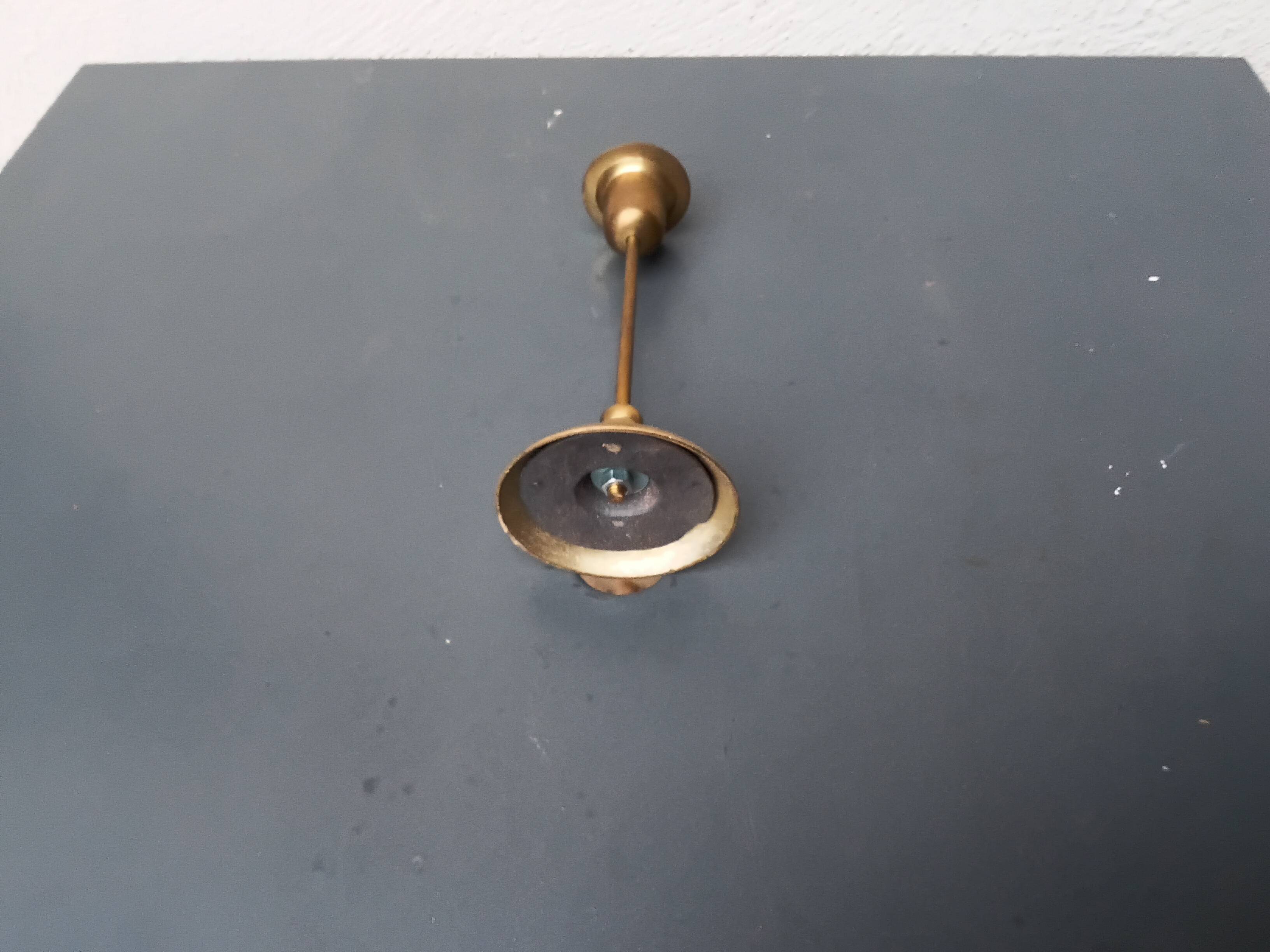 A brass candle holder
