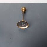 A brass candle holder