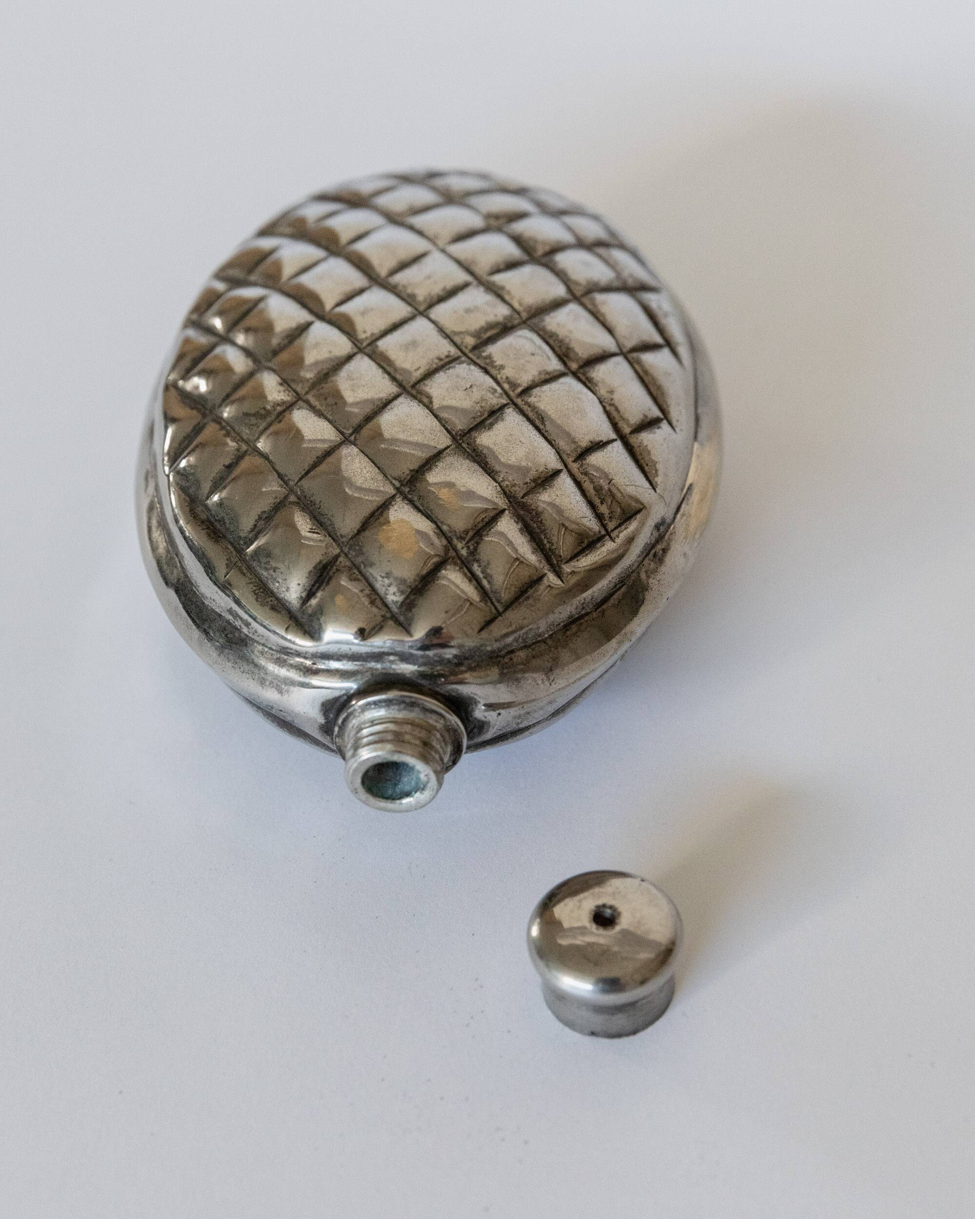 Vintage 1950s silver-plated flask in the shape of a pine cone.