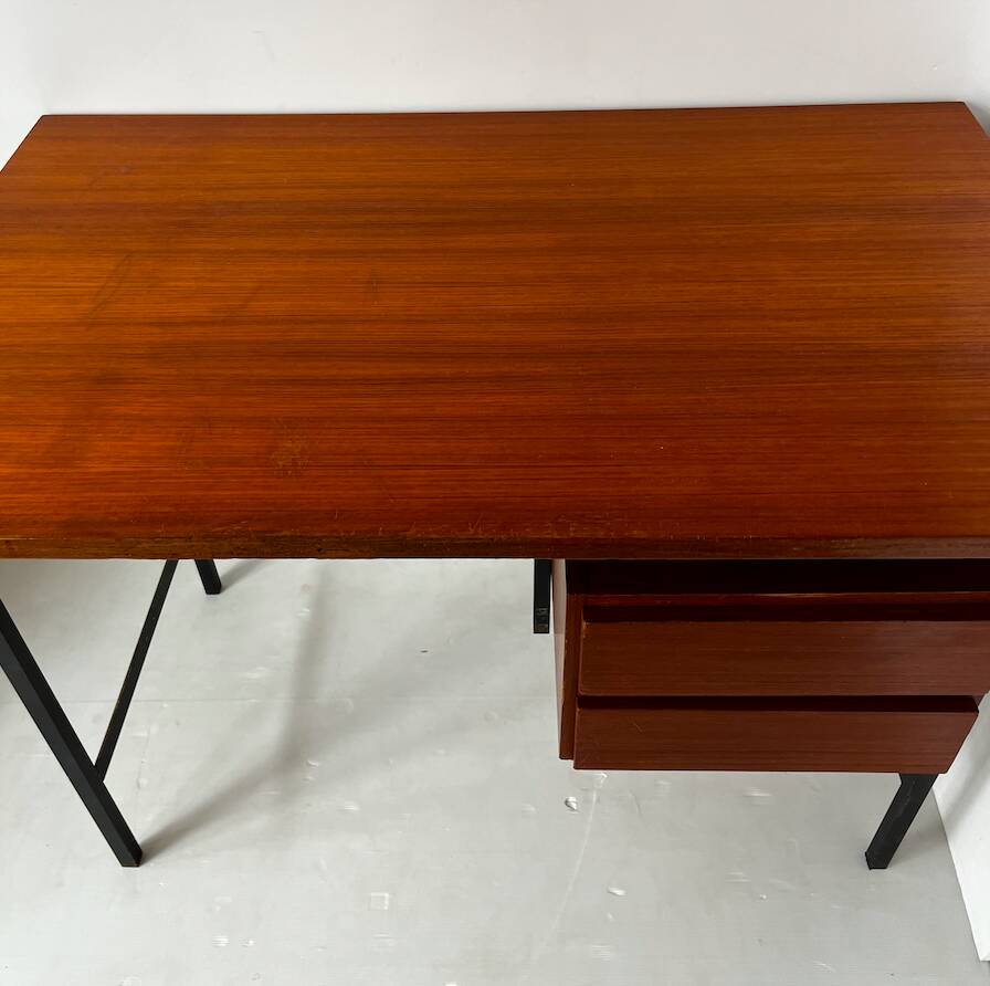Vintage wooden and metal desk in modernist style.