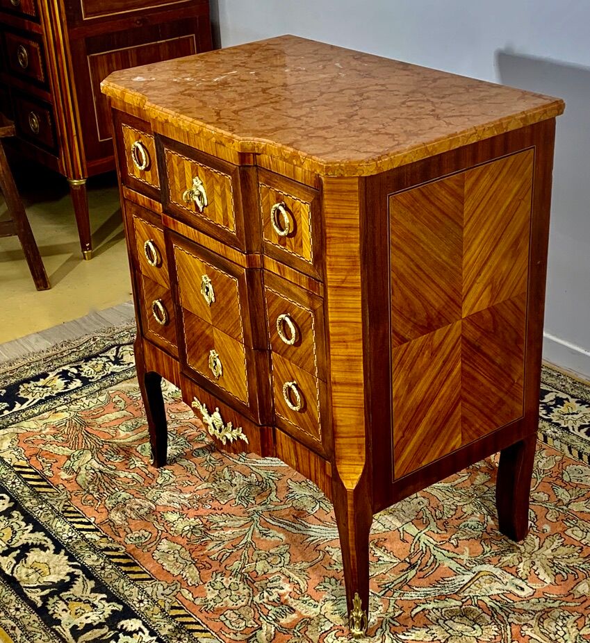 Transition style chest of drawers in rosewood and violet wood, ebony and gilded bronzes